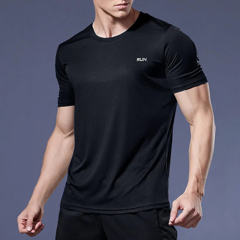 Men's Plush Fashion Hub quick-dry compression shirt, activewear with moisture-wicking fabric, close-up of black athletic top.