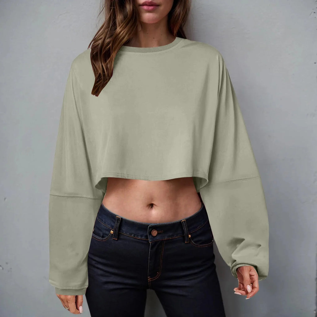Women’s long sleeve loose-fit crop top from Plush Fashion Hub, casualwear with relaxed fit and breathable fabric.