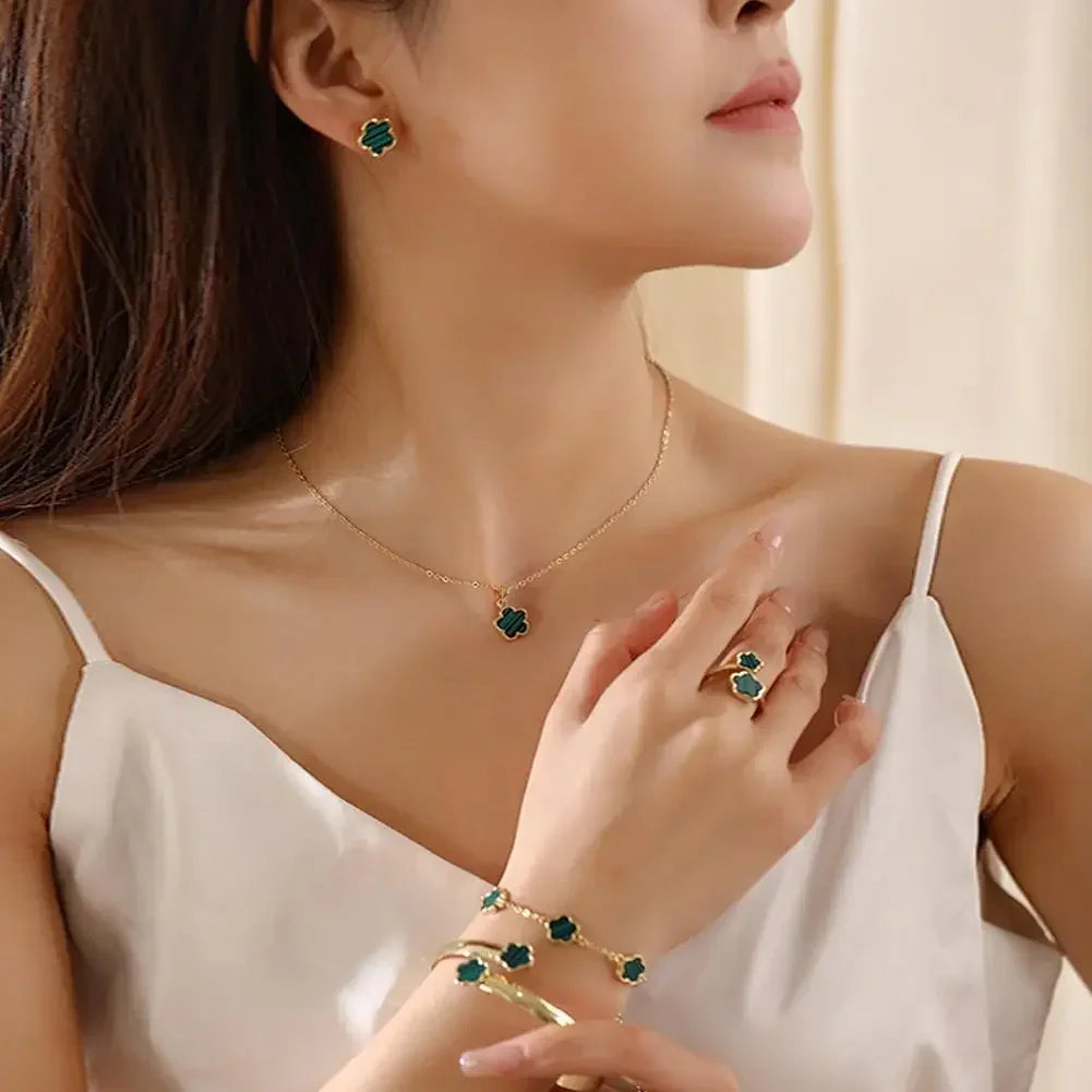 Plum Blossom Flower necklace and earring set featuring five-leaf design, crafted by Plush Fashion Hub, displayed on a neutral background.