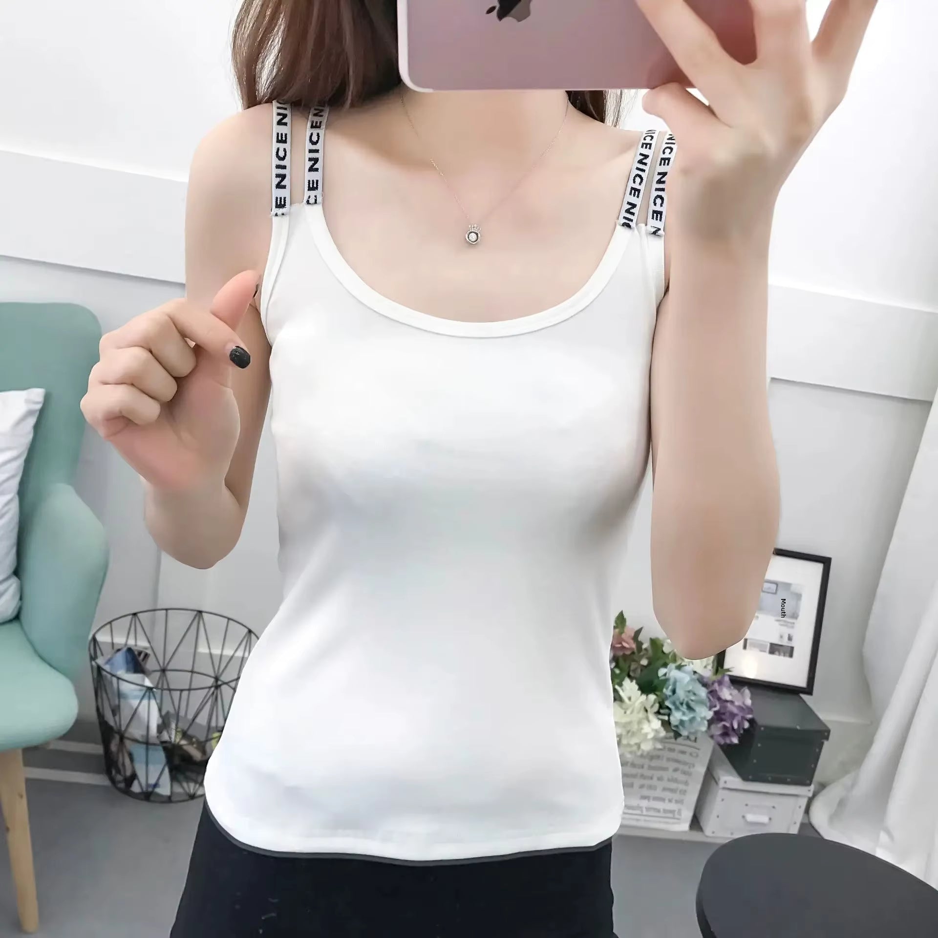 Women’s solid color sleeveless tank top by Plush Fashion Hub, casualwear style, shown in a relaxed fit with smooth fabric.