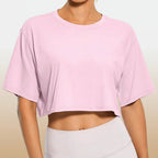 White Y2K Harajuku crop top by FitiqueFit, casualwear, shown on a model with a trendy, youthful style.