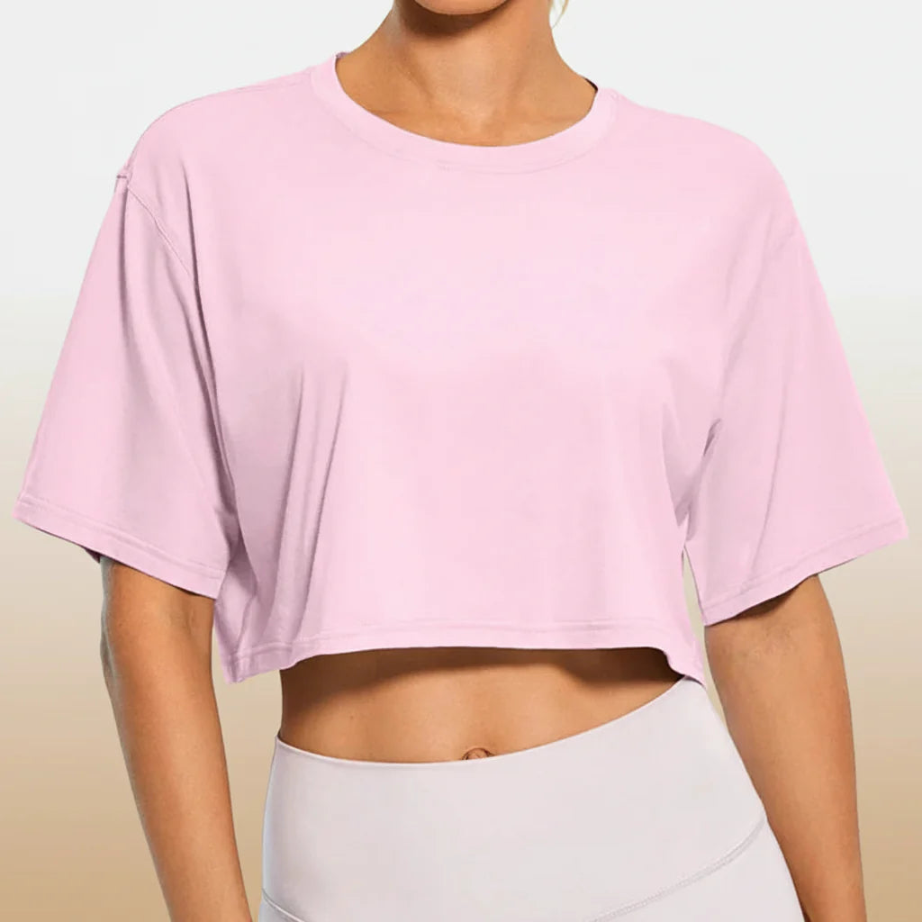 White Y2K Harajuku crop top by FitiqueFit, casualwear, shown on a model with a trendy, youthful style.
