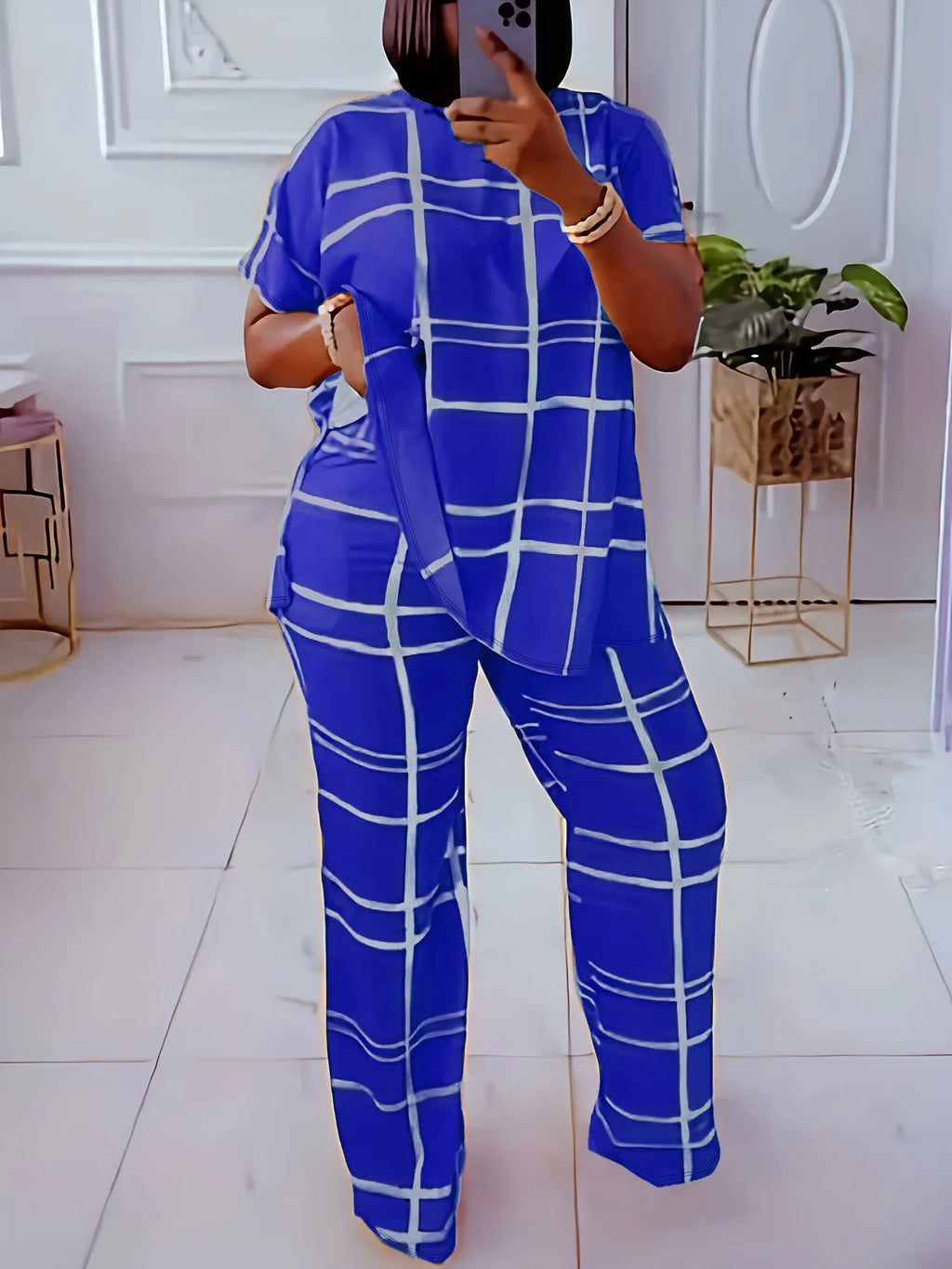 Plus size women’s casual two-piece set with striped grid print and round neck from Plush Fashion Hub, featuring a comfortable, stylish design.