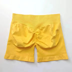 Women's seamless scrunch butt gym shorts by NCLAGEN Gym Wear for high-performance fitness and yoga workouts.