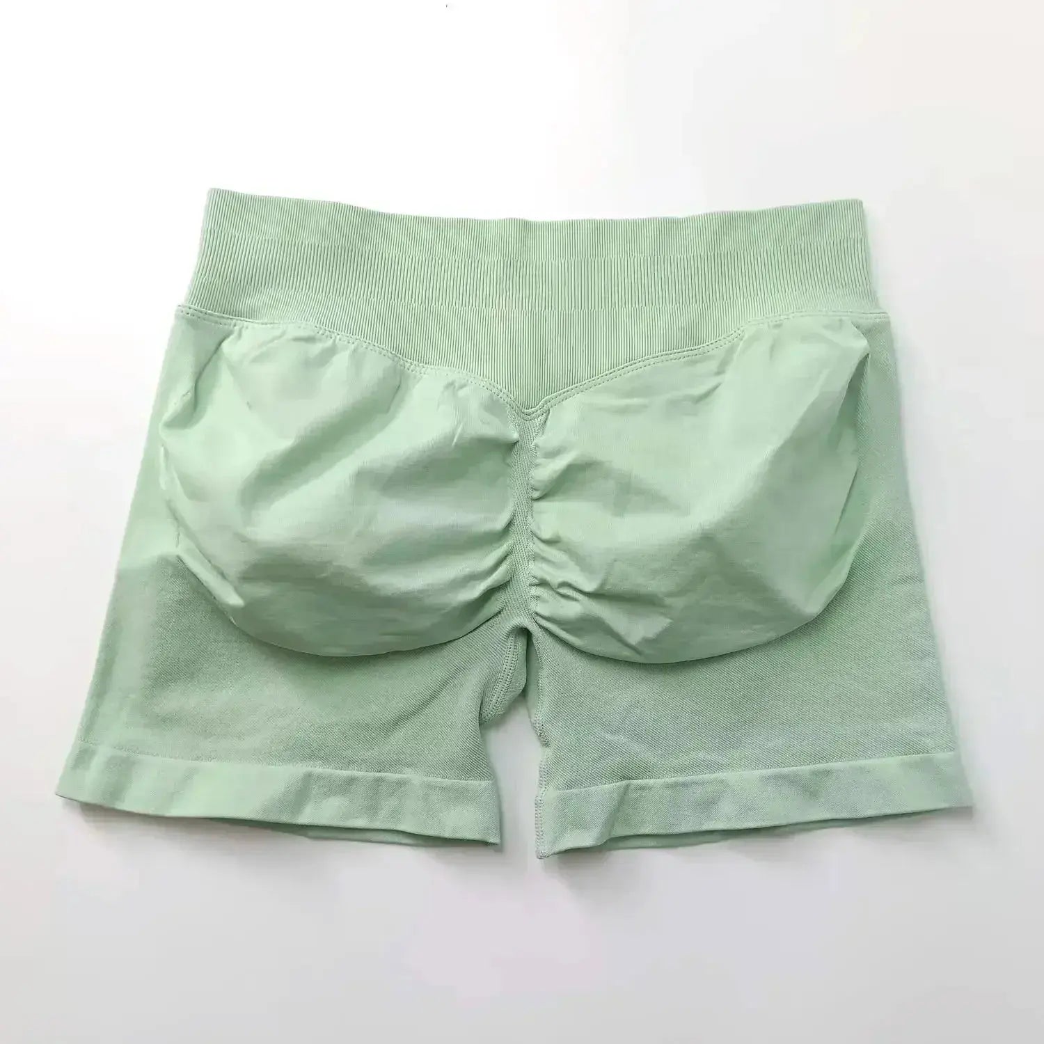 Women's seamless scrunch butt gym shorts for fitness and yoga, designed for high-performance workouts by NCLAGEN Gym Wear.
