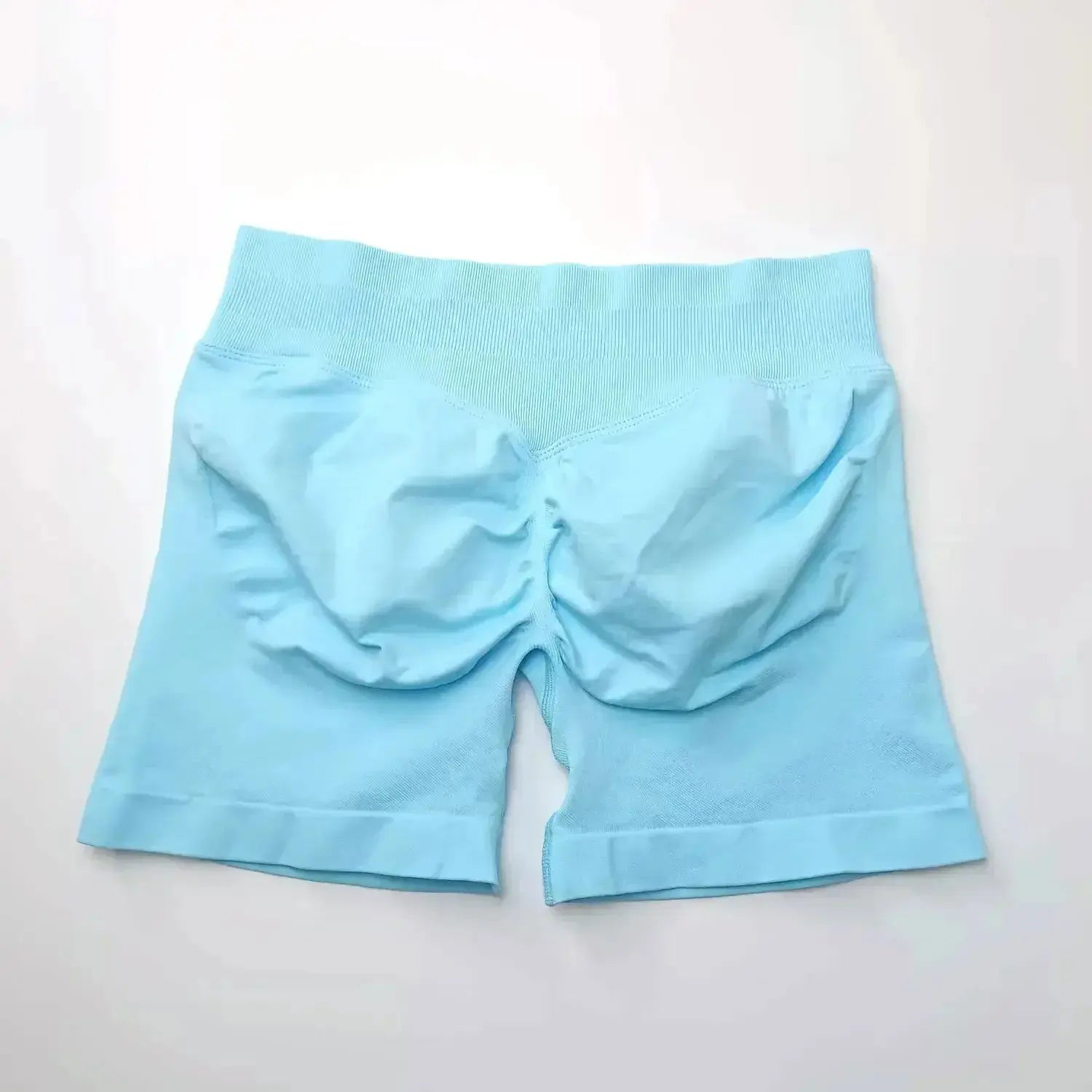Women's seamless scrunch butt gym shorts for fitness and yoga, designed for high-performance workouts, by NCLAGEN Gym Wear.