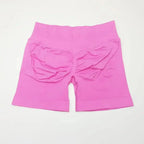 Women's seamless scrunch butt gym shorts for fitness and yoga, designed by NCLAGEN Gym Wear, featuring a high-performance fit.