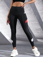Black colorblocked mesh high-waist yoga leggings with side pockets by FitiqueFit, designed for activewear and comfortable movement.