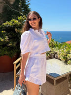 Women’s ruffled linen-blend cropped blouse and shorts set by FitiqueFit, featuring ruffled details and lightweight fabric.