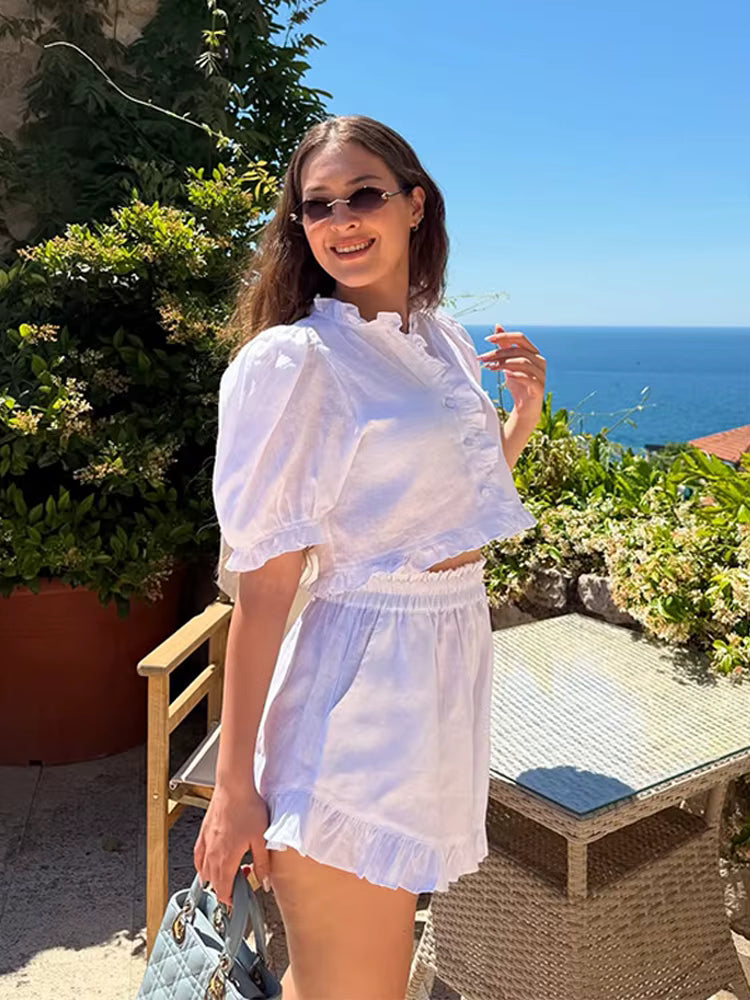 Women’s ruffled linen-blend cropped blouse and shorts set by FitiqueFit, featuring ruffled details and lightweight fabric.