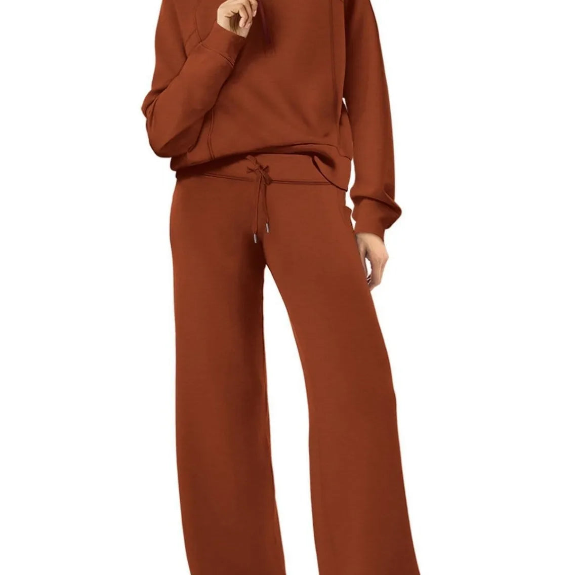 Women two-piece sweatshirt and wide-leg pants set by Plush Fashion Hub, featuring a cozy sweatshirt and stylish wide-leg pants.