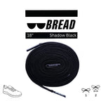 Shadow Black elastic shoelaces from Plush Fashion Hub, showing close-up of sleek black flexible laces for shoes.