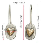 Polished silver minimalist geometric love heart earrings with romantic design, crafted by Plush Fashion Hub.