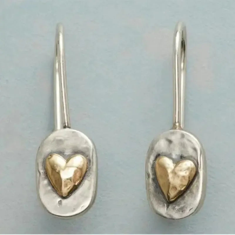 Polished silver minimalist geometric love heart earrings with romantic shape from Plush Fashion Hub.