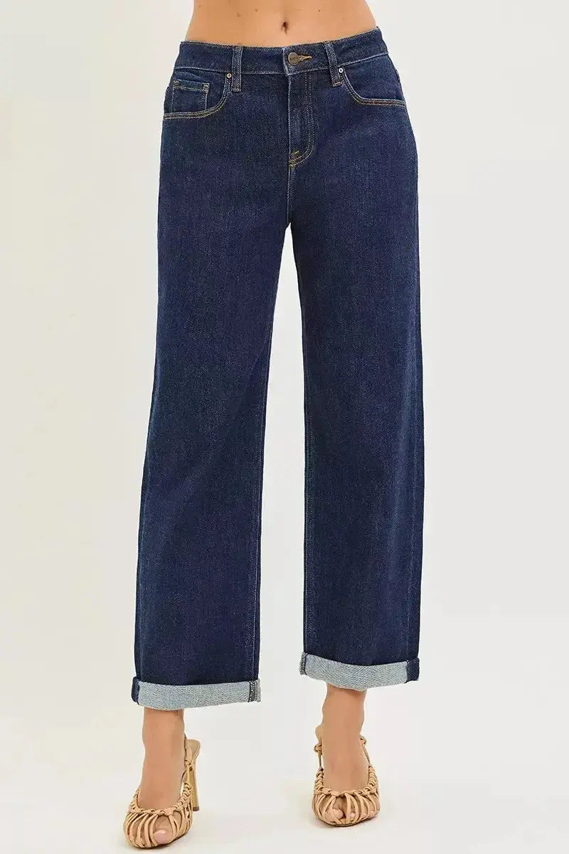 Slouchy cropped boyfriend jeans with cuffed hem from Trendsi, showcasing relaxed fit and trendy distressed details.