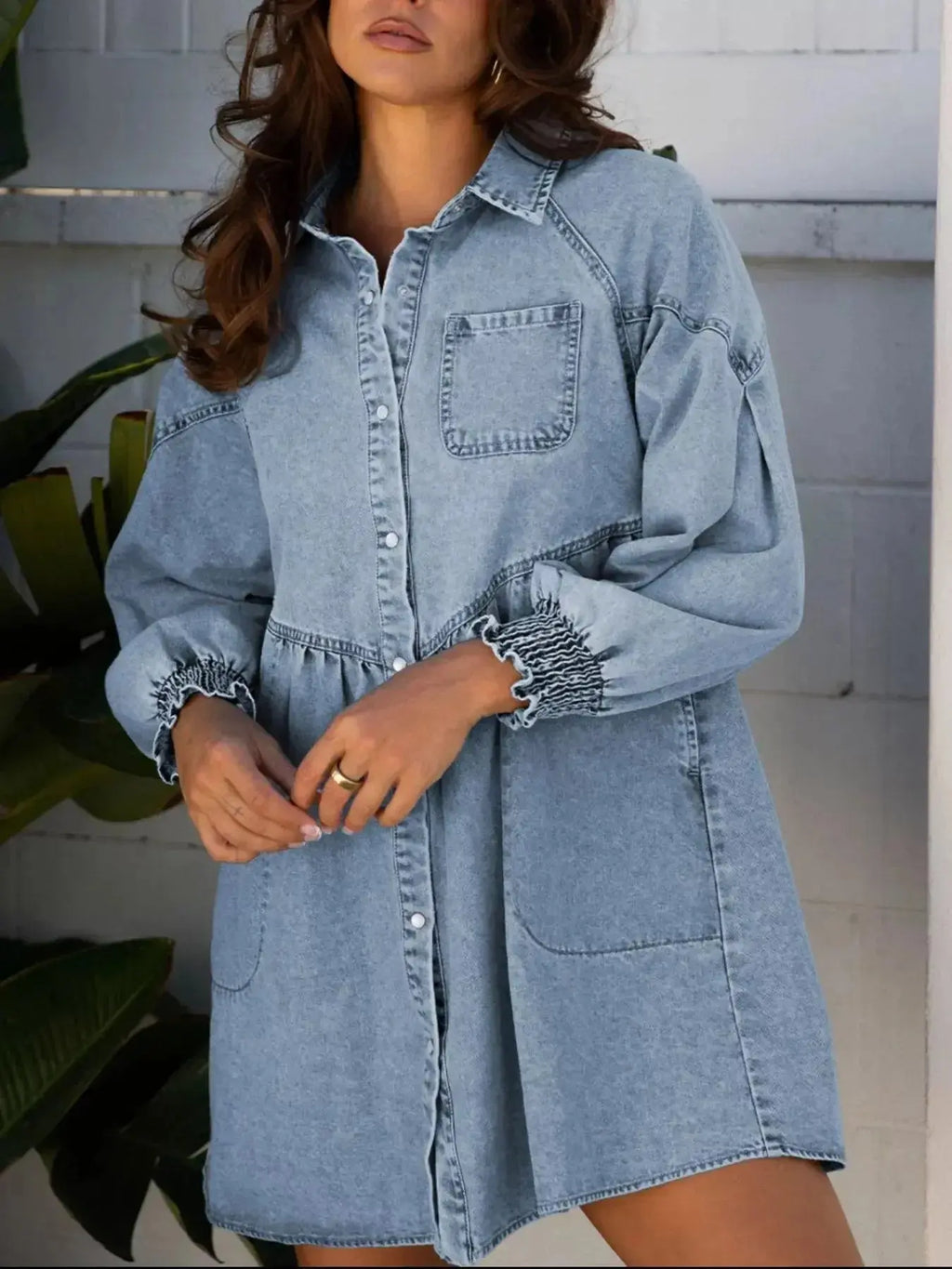 Casual denim mini dress with smocked cuffs and flared silhouette, featuring a button-down front, by Trendsi.