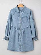 Casual denim mini dress with smocked cuffs, flared silhouette, button-down front, by Trendsi, perfect for a relaxed, stylish look.
