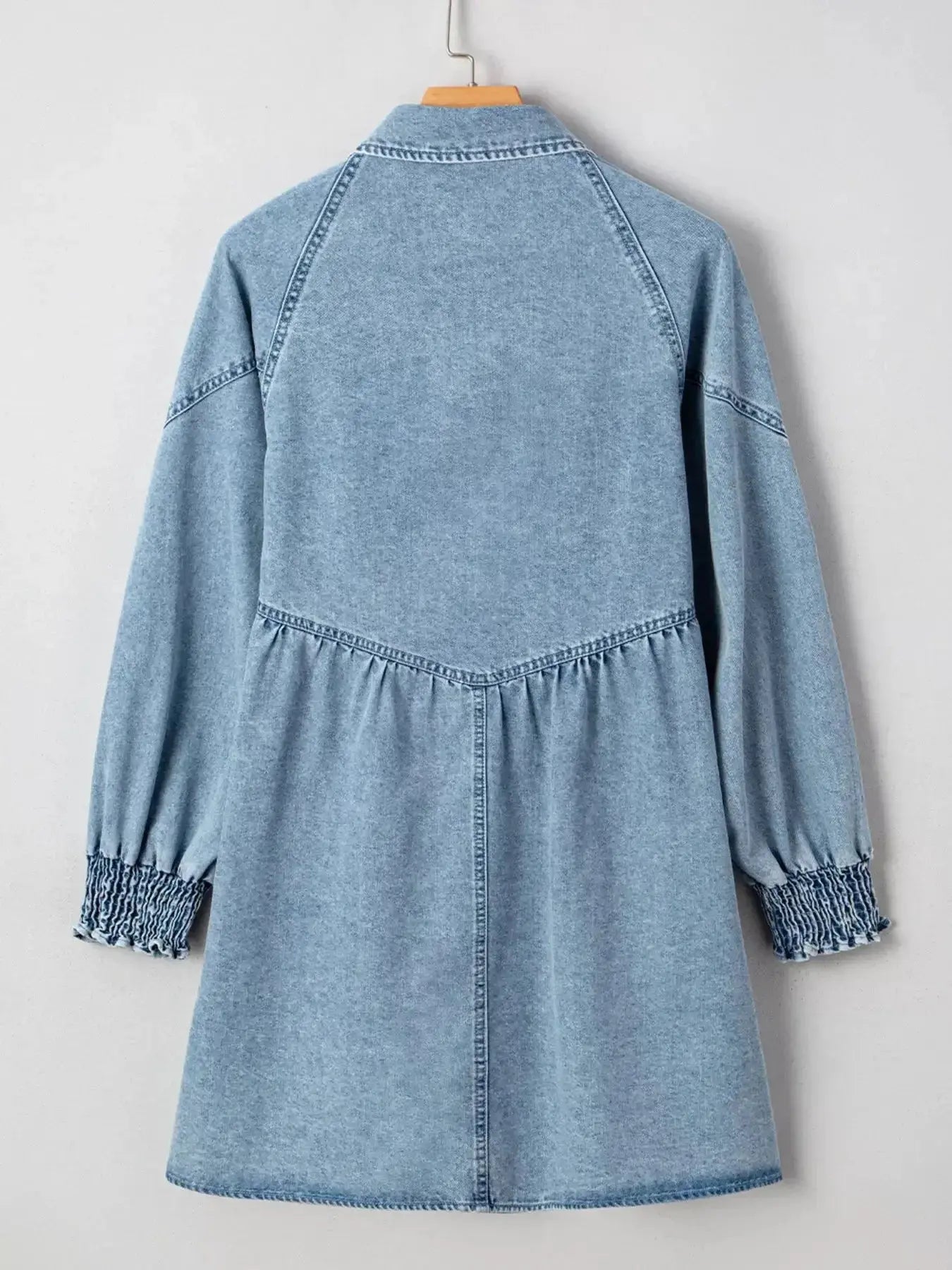 Casual denim mini dress with smocked cuffs and flared silhouette, featuring a button-down front, by Trendsi.