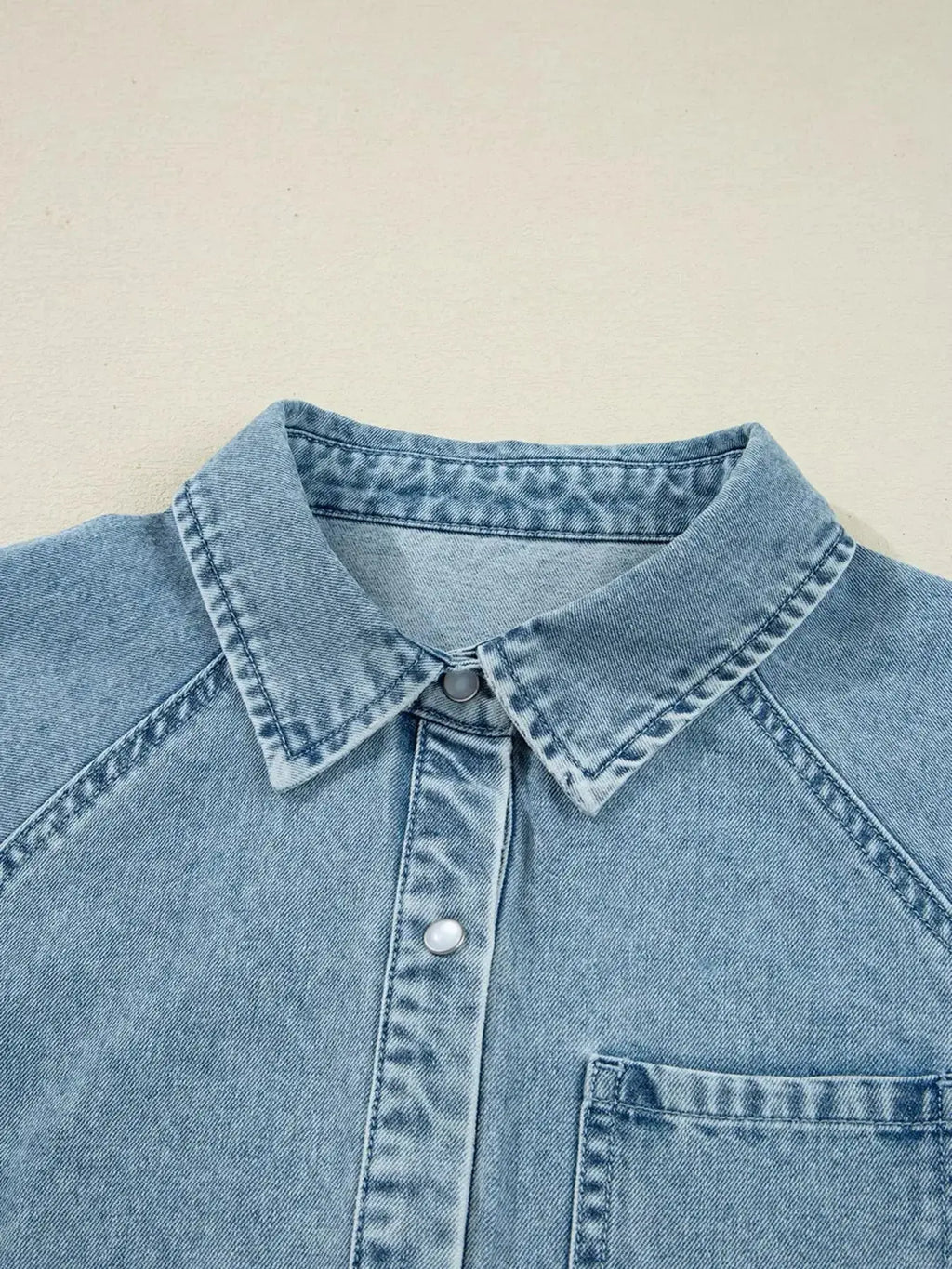 Casual denim mini dress with smocked cuffs, flared silhouette, button-down front, by Trendsi, featuring classic jean fabric and style
