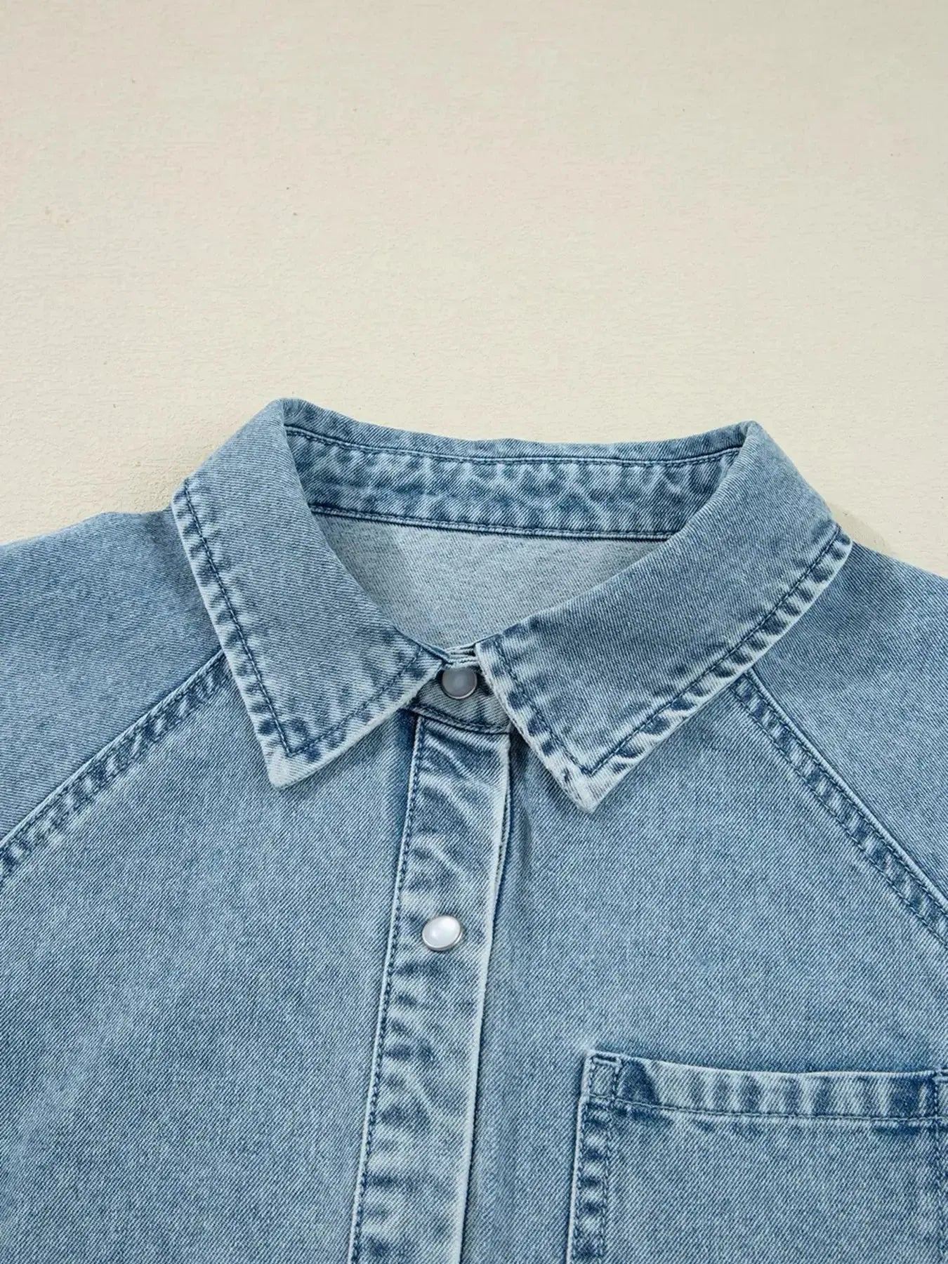 Casual denim mini dress with smocked cuffs, flared silhouette, button-down front, by Trendsi, featuring classic jean fabric and style