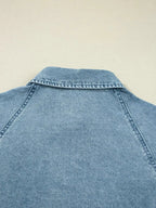 Casual denim mini dress with smocked cuffs, flared silhouette, button-down front, from Trendsi's smocked cuff flared denim shirt dress collection.