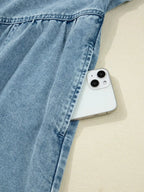 Smocked cuff flared denim shirt mini dress by Trendsi featuring casual button-down style with long sleeves and a fitted waist.