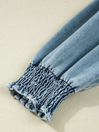 Casual denim mini dress with smocked cuffs and flared silhouette, featuring a button-down front, by Trendsi.