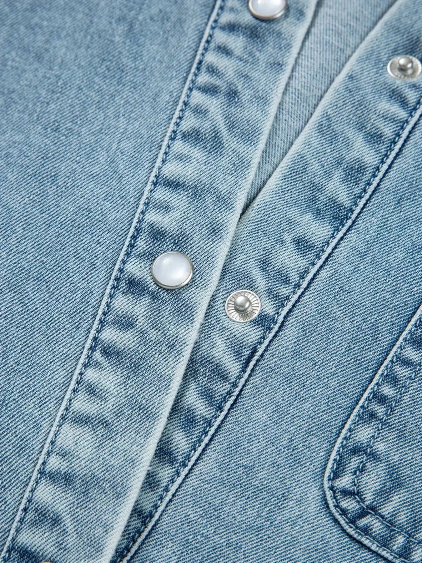 Casual denim mini dress with smocked cuffs and flared hem, featuring a button-down front, from Trendsi's denim collection.