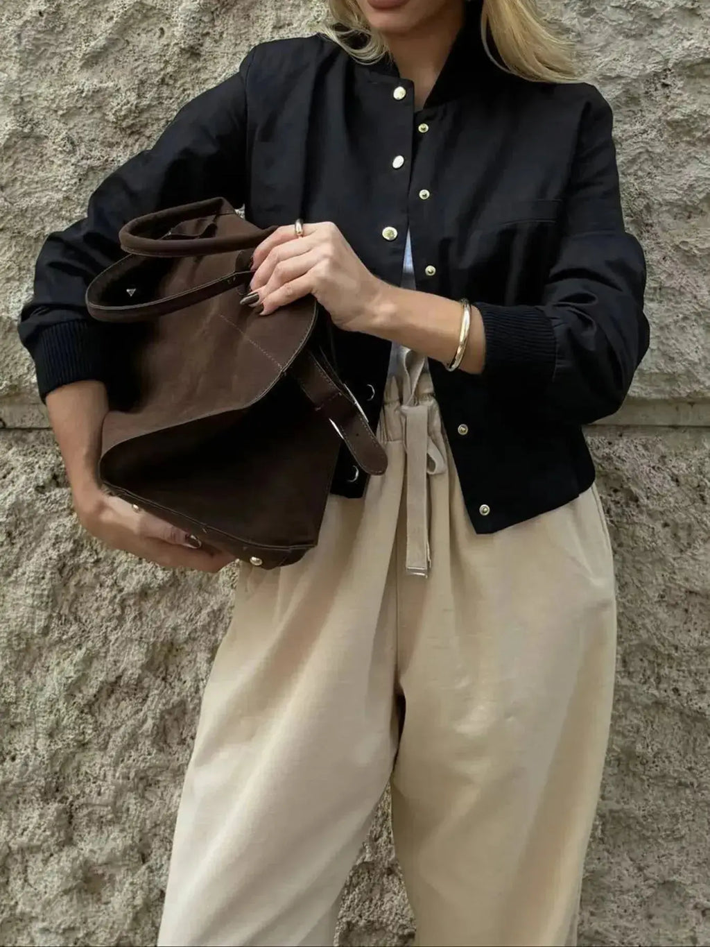 Women's cropped bomber jacket by Trendsi featuring snap buttons and lightweight casual outerwear style.
