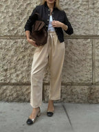 Women's lightweight cropped bomber jacket with snap buttons, casual outerwear by Trendsi, shown in a stylish, cropped fit.