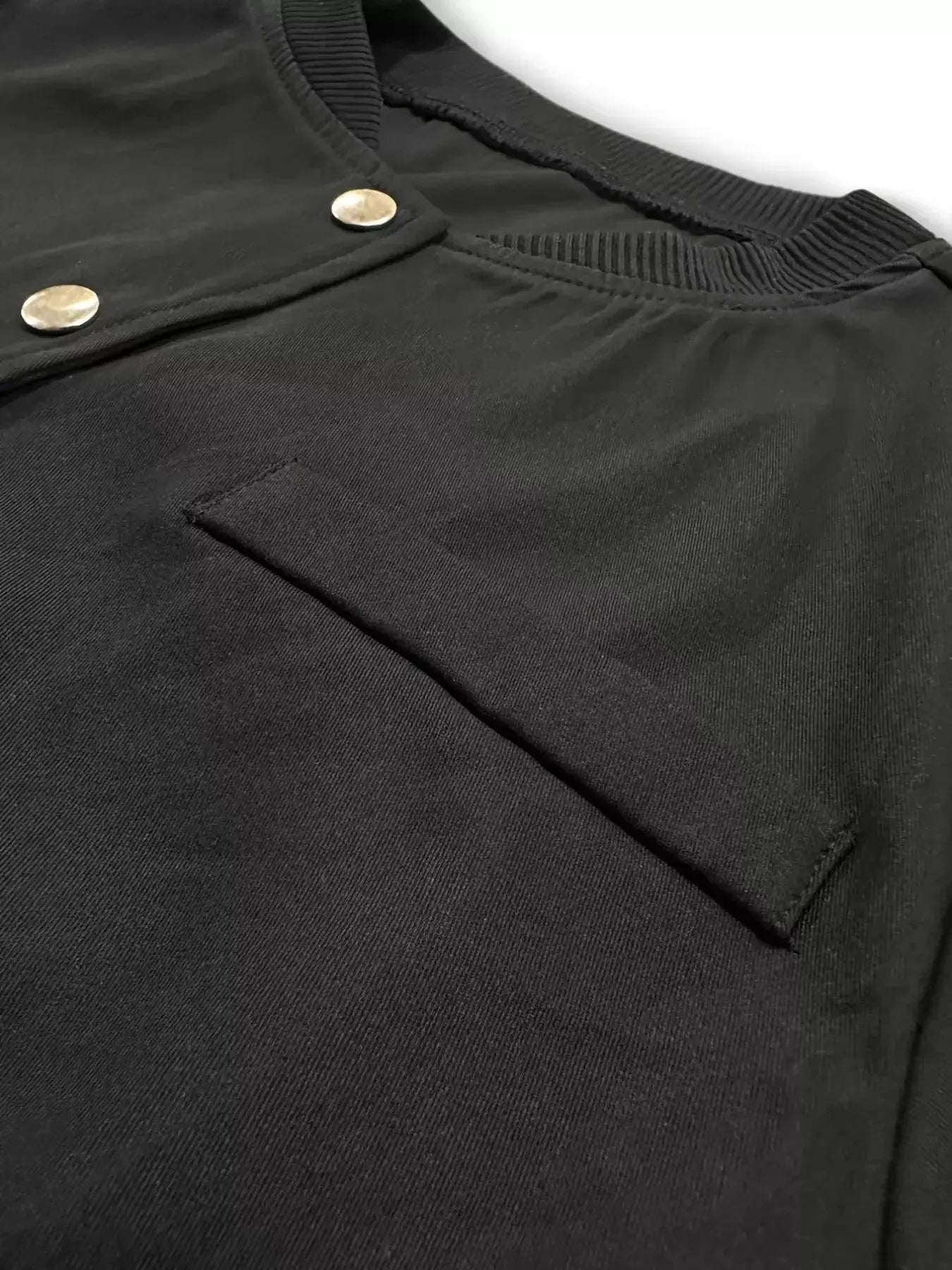 Women's cropped bomber jacket by Trendsi featuring a snap-down front, lightweight casual outerwear with a stylish, modern design.