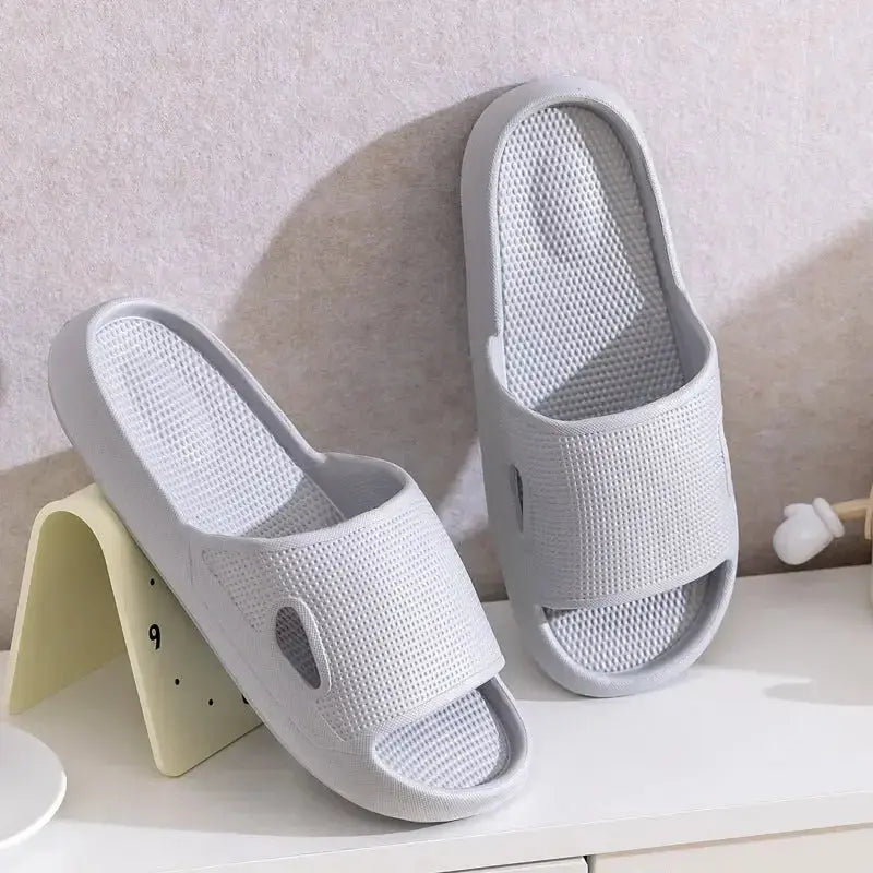 Unisex thick sole EVA bathroom slippers by Plush Fashion Hub with non-slip bottom, lightweight indoor slide in solid color.