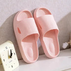 Solid-colored unisex bathroom slippers with thick soles and non-slip EVA bottoms, lightweight indoor slides by Plush Fashion Hub.