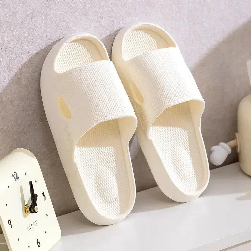 Unisex thick sole non-slip EVA bathroom slippers in solid color, lightweight indoor slide footwear by Plush Fashion Hub.