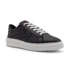 Black BLKSWN Footwear lowtop sneaker with solid black design, shown from an angled side view.