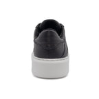 Black BLKSWN Footwear low-top sneaker with solid black design, shown from the back view.
