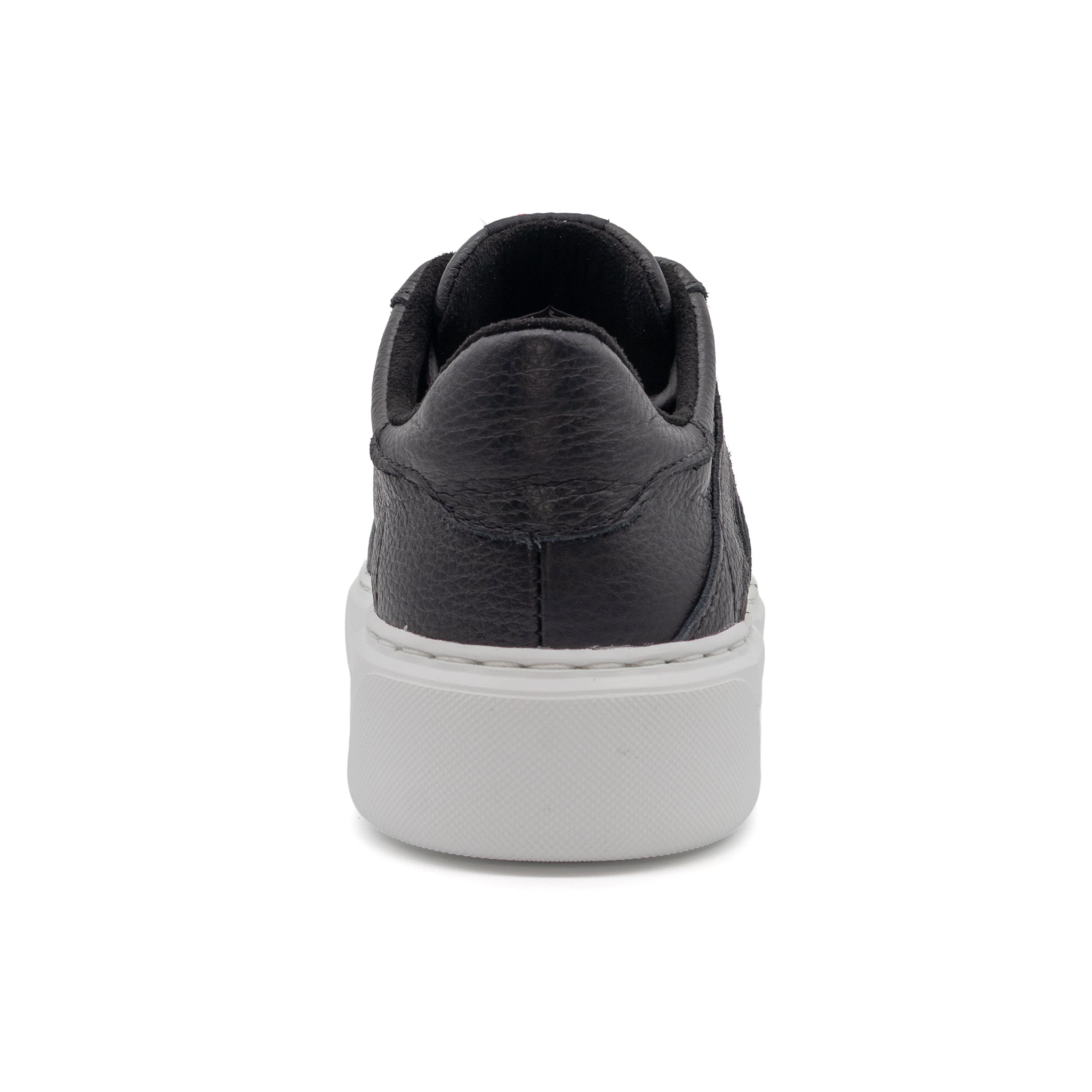 Black BLKSWN Footwear low-top sneaker with solid black design, shown from the back view.