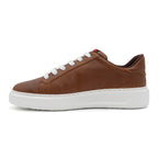Brown BLKSWN Footwear 601 Solid lowtop sneaker, left shoe view with brown leather upper and white sole.