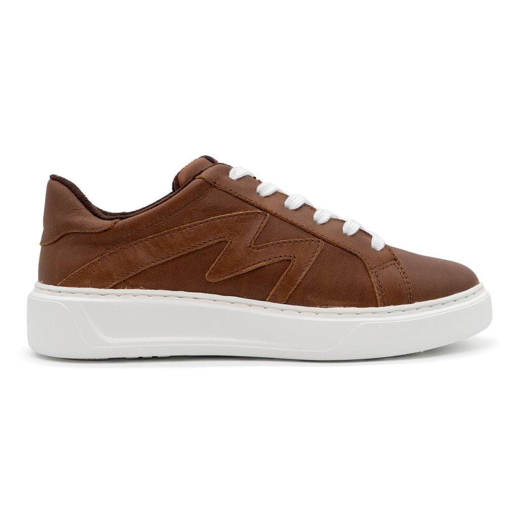 Brown BLKSWN Footwear 601 Solid lowtop sneaker, right shoe, with smooth brown upper and white sole detail.