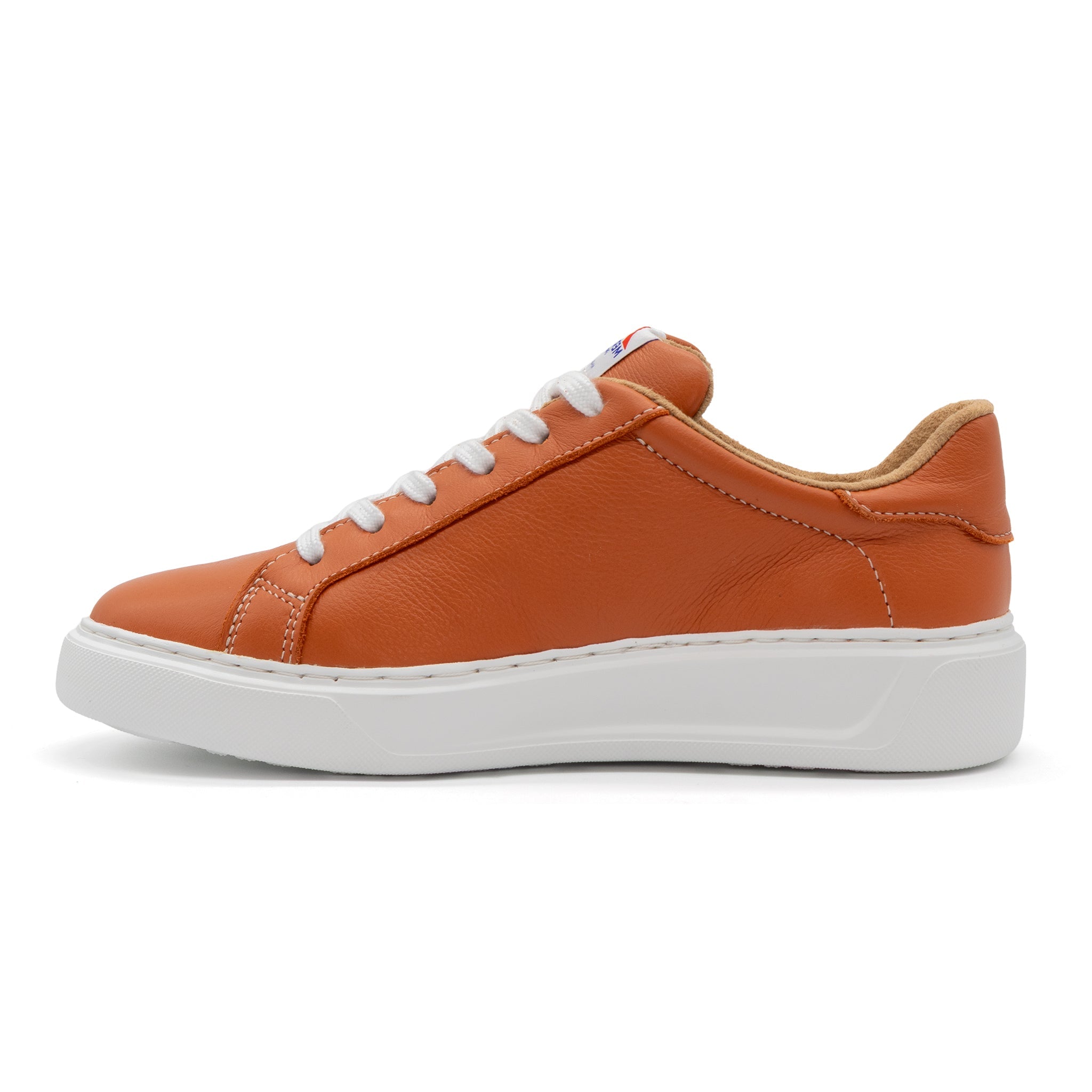 Left view of BLKSWN Footwear 601 Solid Burnt Orange lowtop sneaker showing the vibrant burnt orange color and low-profile design.