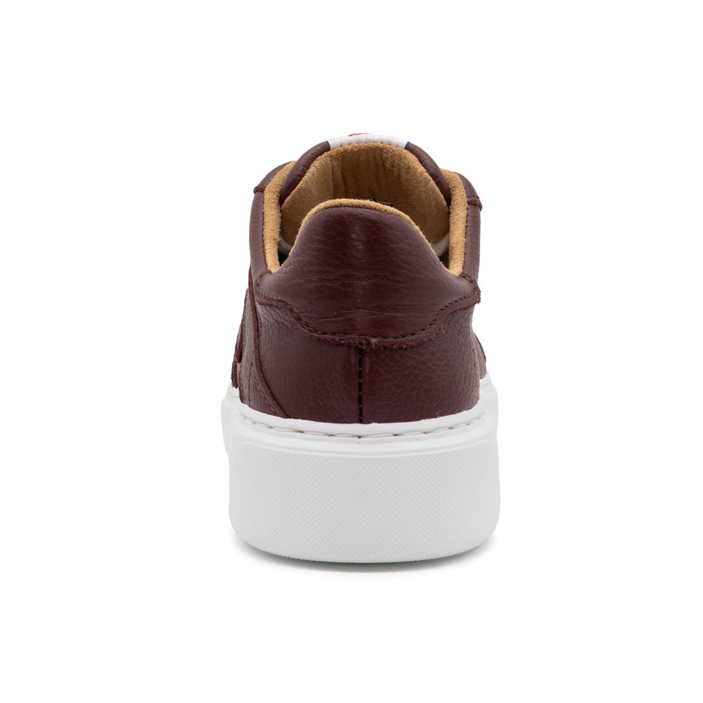 Maroon lowtop sneakers from BLKSWN Footwear, featuring a solid color design and visible back view.