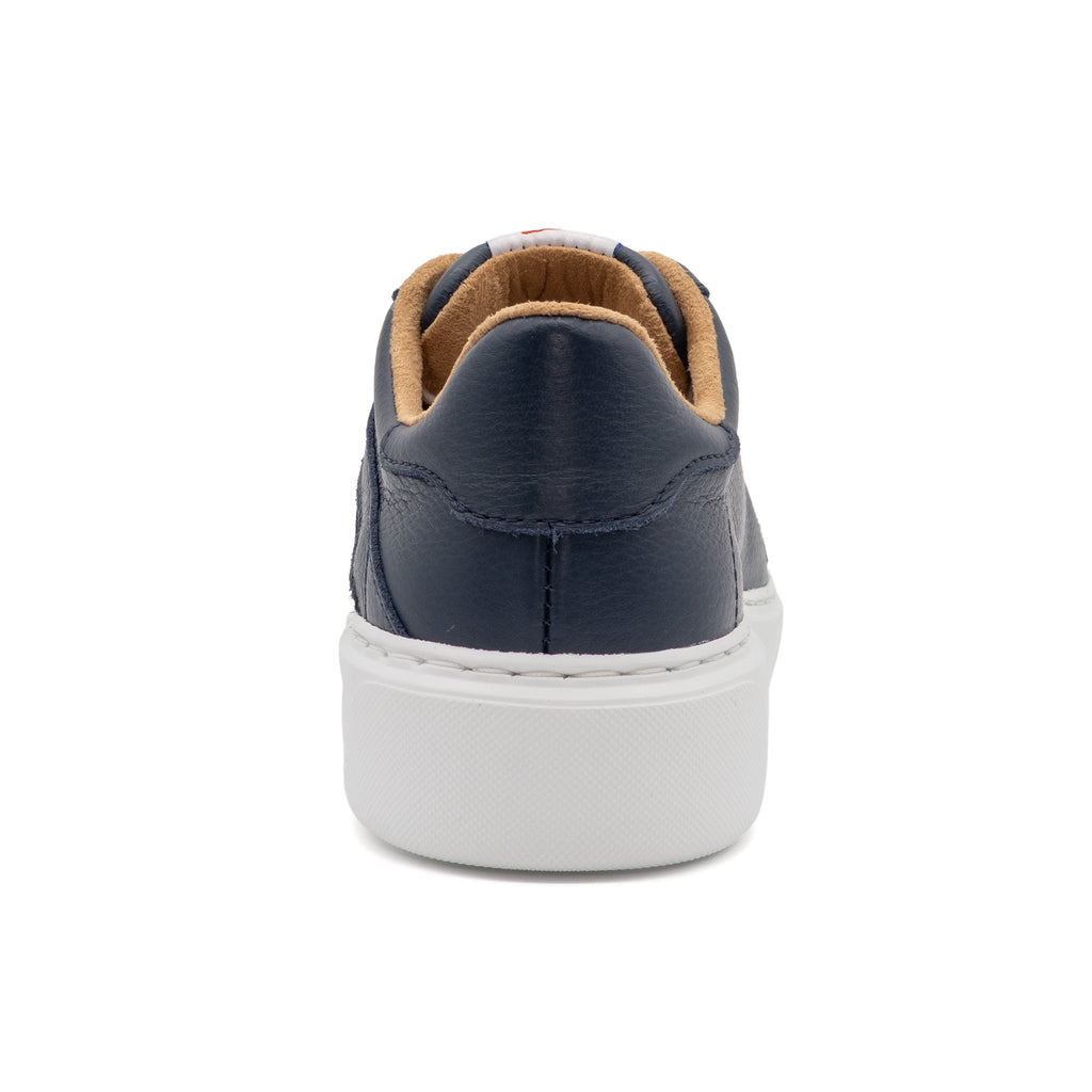 Navy blue BLKSWN Footwear 601 Solid lowtop sneakers shown from the back view, showcasing the solid navy design and low-cut style.