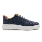 Navy blue BLKSWN Footwear lowtop sneaker with solid color design, right shoe displayed against a neutral background.
