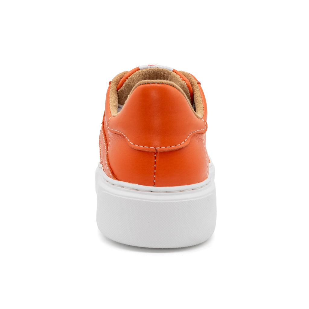 Orange BLKSWN Footwear 601 Solid lowtop sneaker shown from the back, highlighting the vibrant color and sleek design.