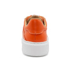 Orange BLKSWN Footwear 601 Solid lowtop sneaker shown from the back, highlighting the vibrant color and sleek design.