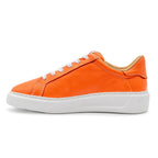 Orange BLKSWN Footwear 601 Solid low-top sneaker, left side view showing smooth orange fabric and white sole detail.