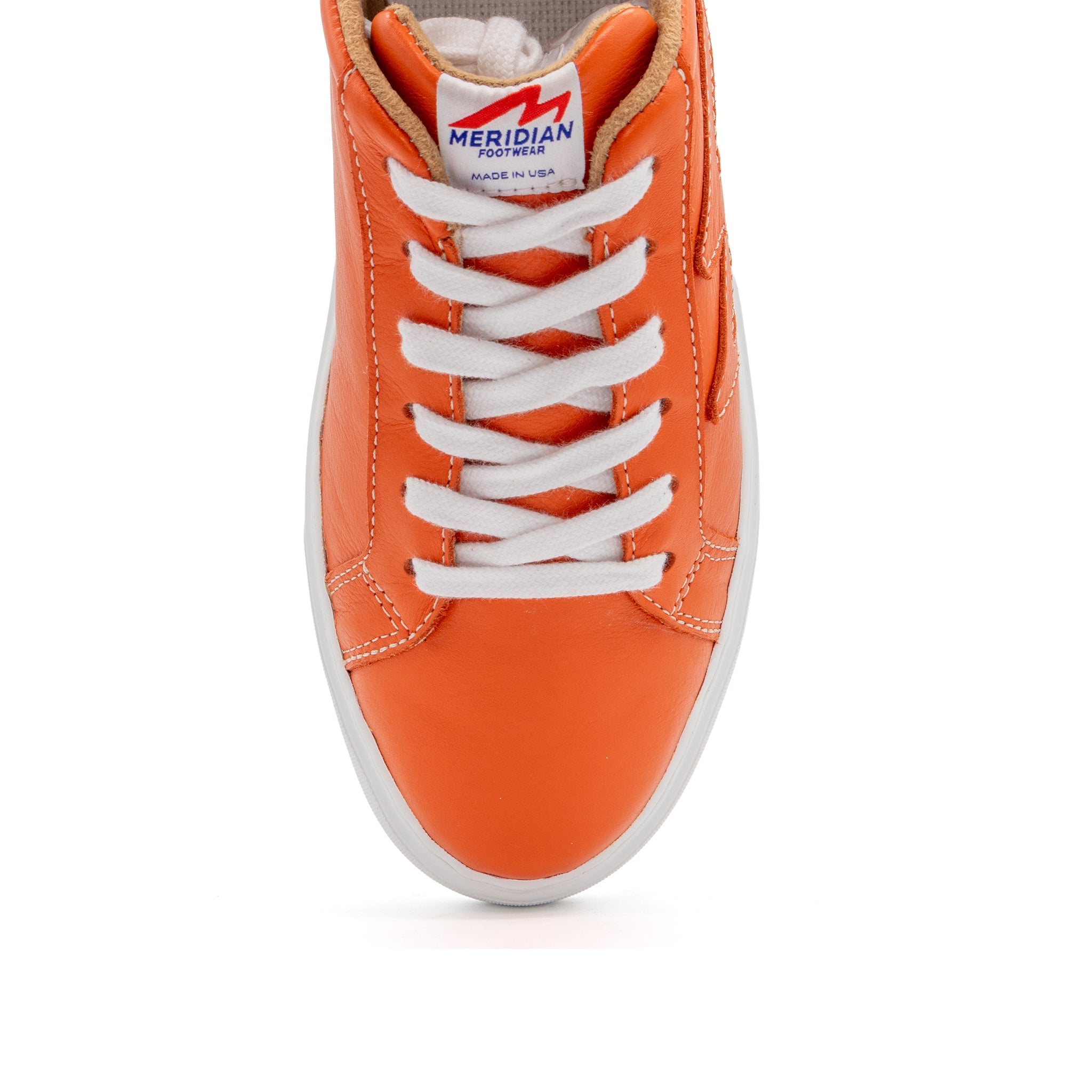 Orange BLKSWN Footwear 601 Solid low-top sneaker showing the solid orange canvas upper and white rubber sole.