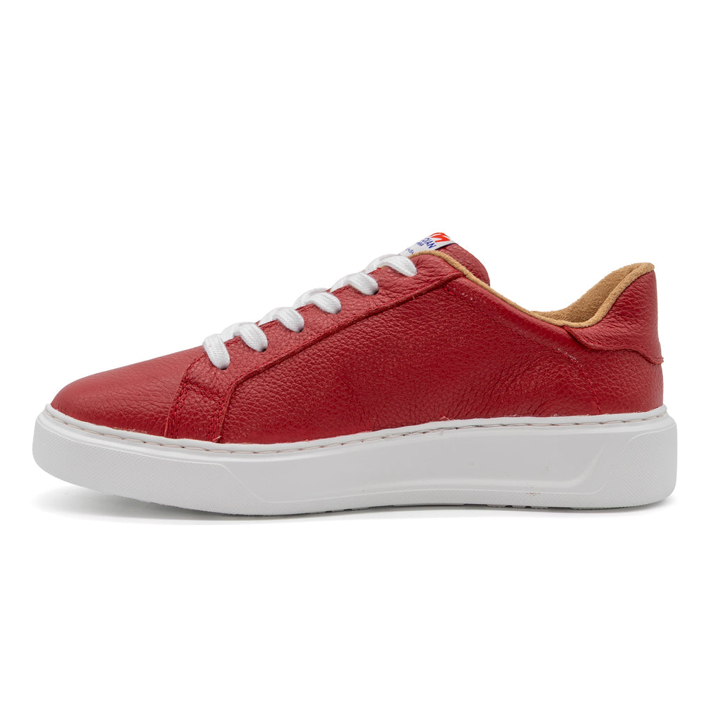 Red BLKSWN Footwear lowtop sneaker with solid design, featuring a comfortable canvas upper and flat rubber sole.