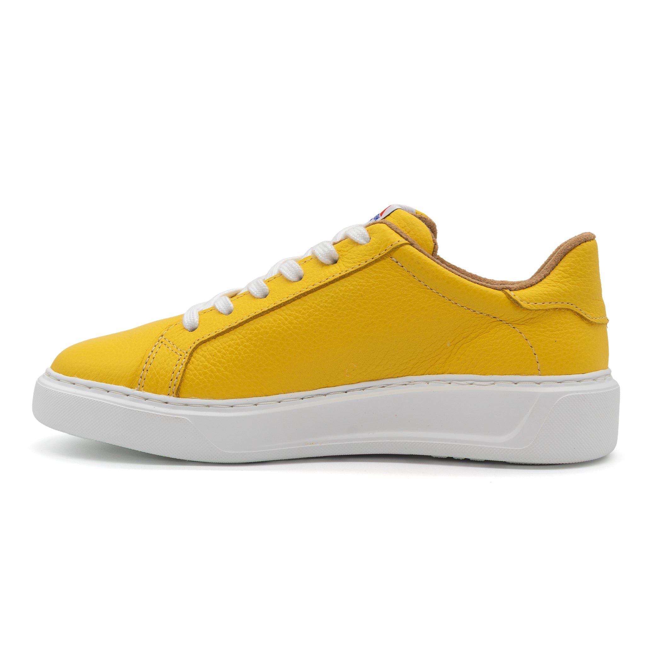 Yellow BLKSWN Footwear 601 Solid lowtop sneaker shown from the left side, highlighting the vibrant color and sleek design.