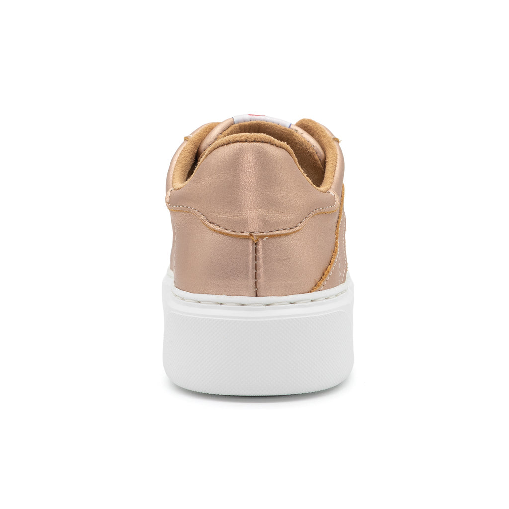 Women's BLKSWN Footwear 601 Solid metallic rose gold lowtop sneaker shown from the back view.